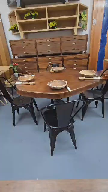 Live edge African maple, finished in Mahogany.