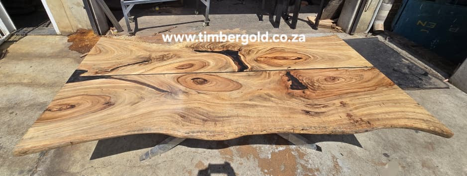 Live edge African Wild Oak, with mini-black epoxy resin.