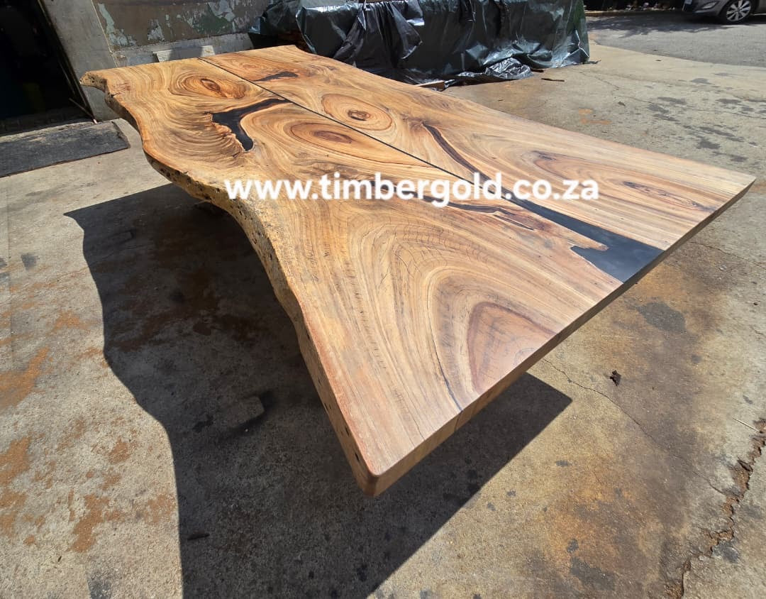 Live edge African Wild Oak, with mini-black epoxy resin.