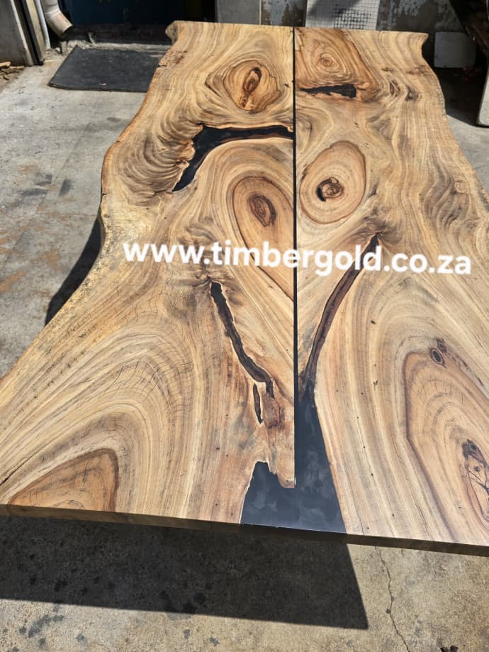 Live edge African Wild Oak, with mini-black epoxy resin.